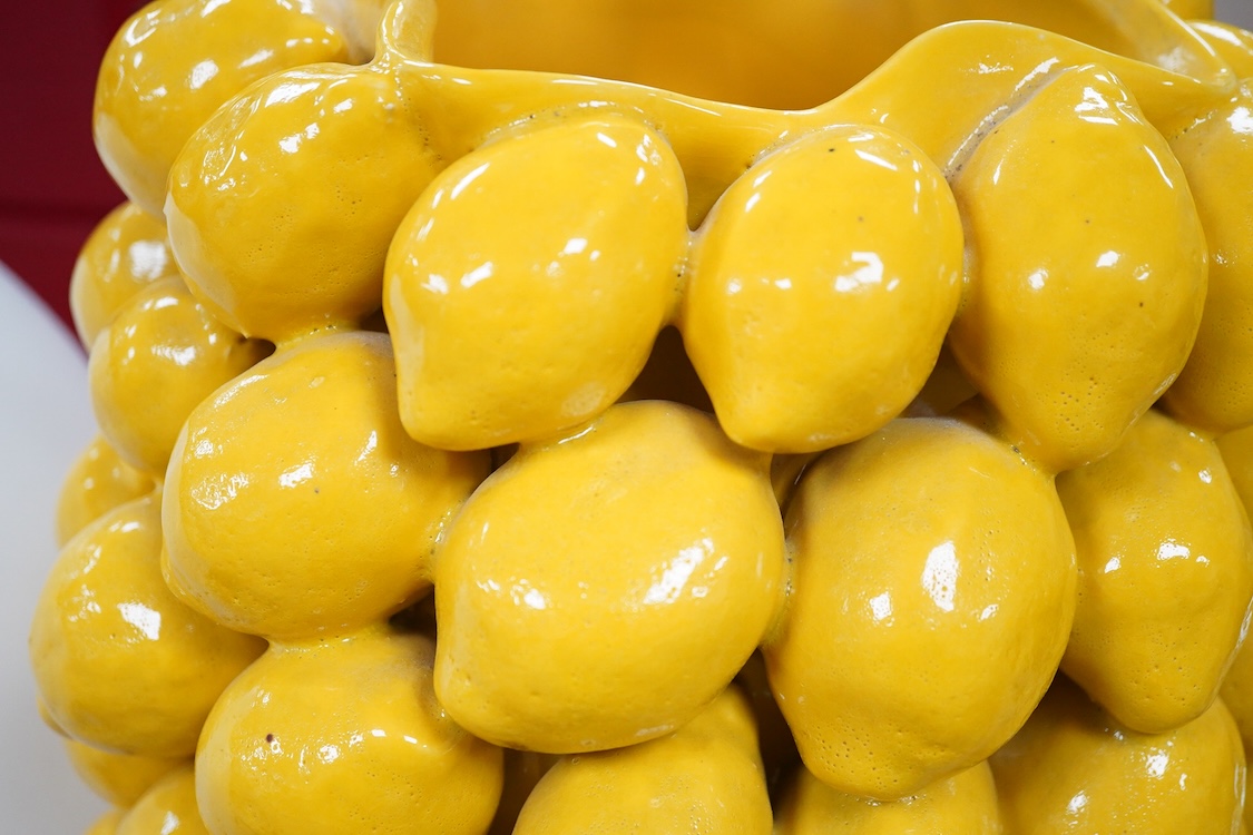 A large yellow glazed ceramic ‘lemons’ vase, 45cm